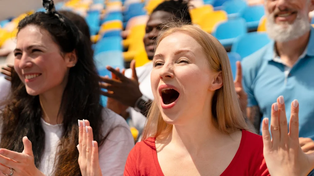 a sports fan enjoy and react with the match event