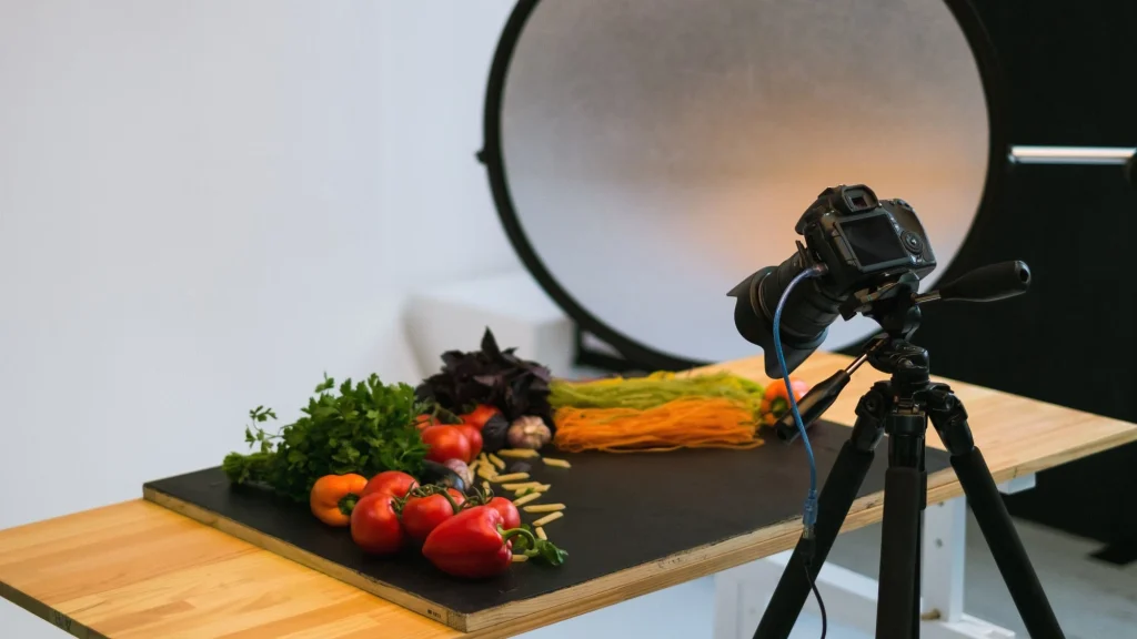 Tethered camera shooting fresh vegetables and pasta styled for a food product shoot