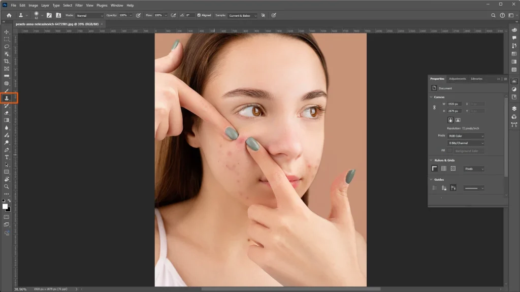 Photoshop Clone Stamp Tool selected for controlled blemish removal and photo retouching