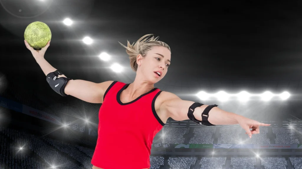 Handball player captured mid-throw against stadium lights, edited for dynamic sports photography