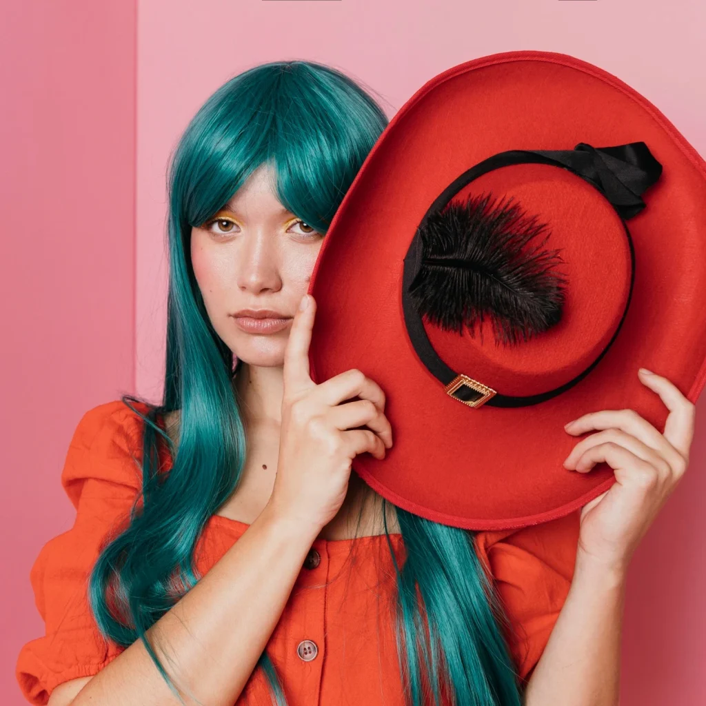 Editorial fashion portrait featuring a model with a statement hat for creative brand storytelling.