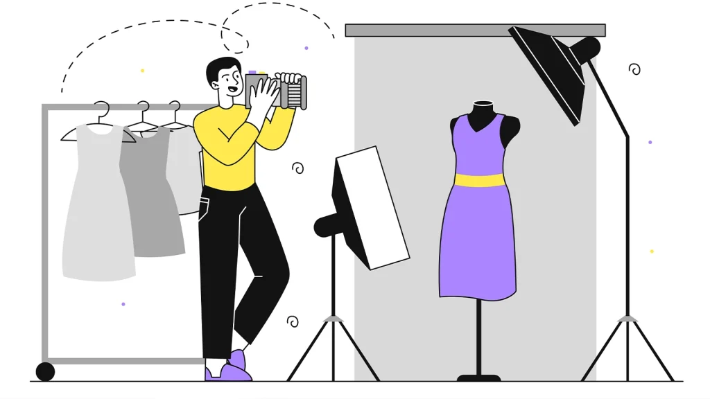 Fashion photographer taking clothing photos in a professional studio setup