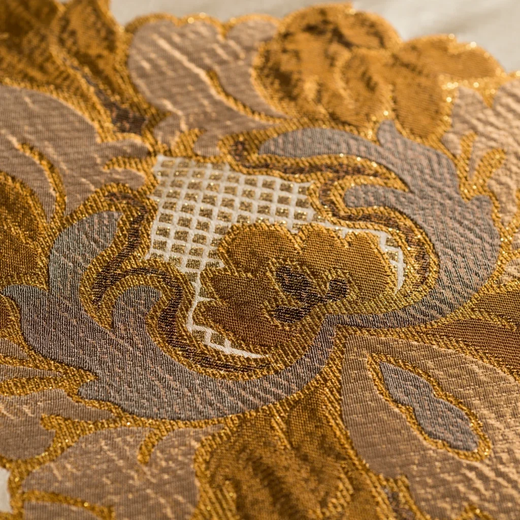 Close-up macro photograph highlighting intricate woven fabric texture and stitching details.