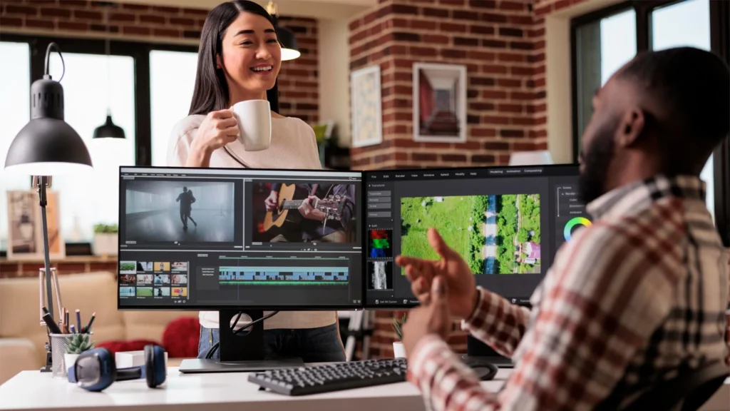 In-house creative team reviewing edits across dual monitors to keep visual style consistent
