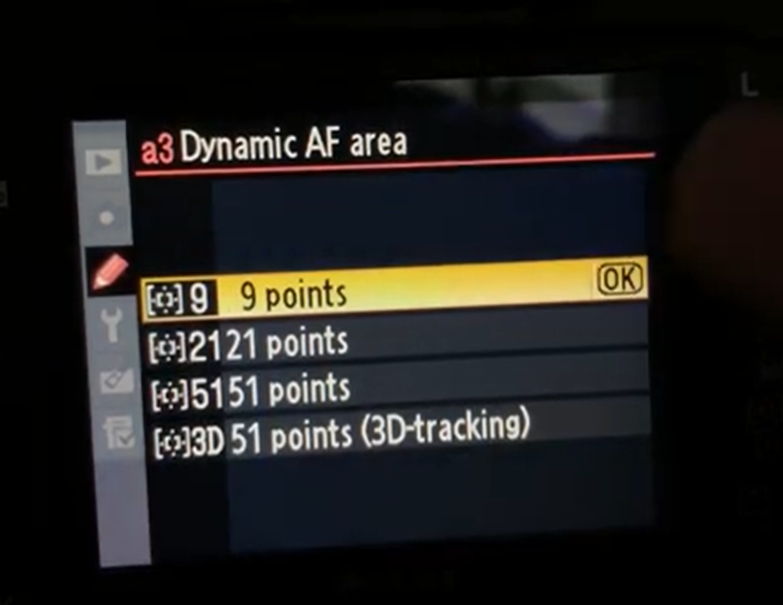 Nikon sports photography settings showing Dynamic-Area AF with 9, 21, and 51-point autofocus options.