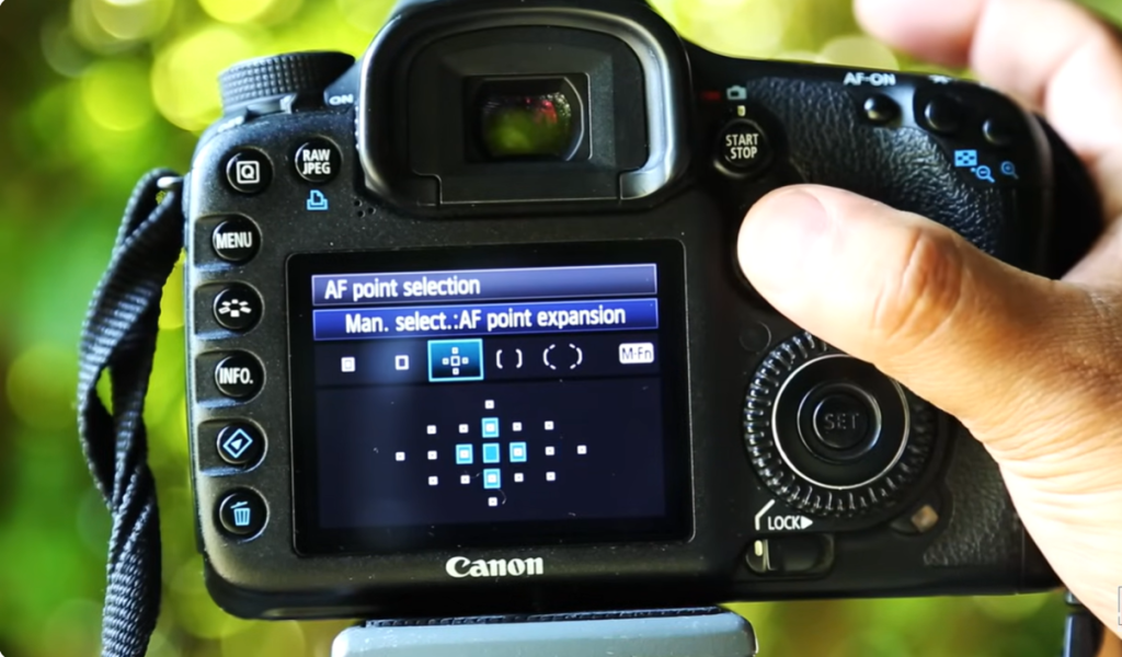 Canon camera autofocus settings with AF point expansion for sports photography.