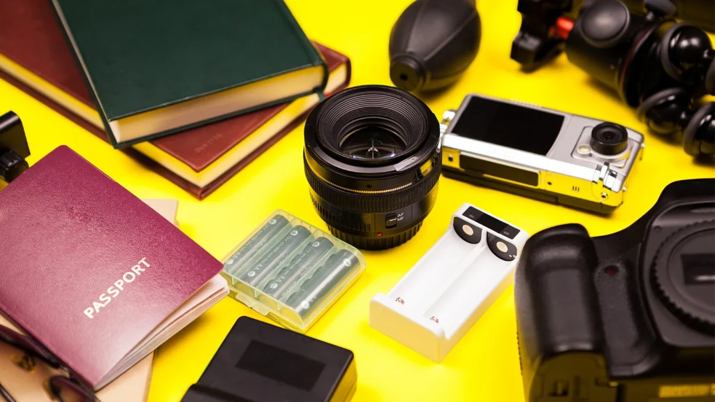 Product photography equipment including camera lens, batteries, and photography accessories