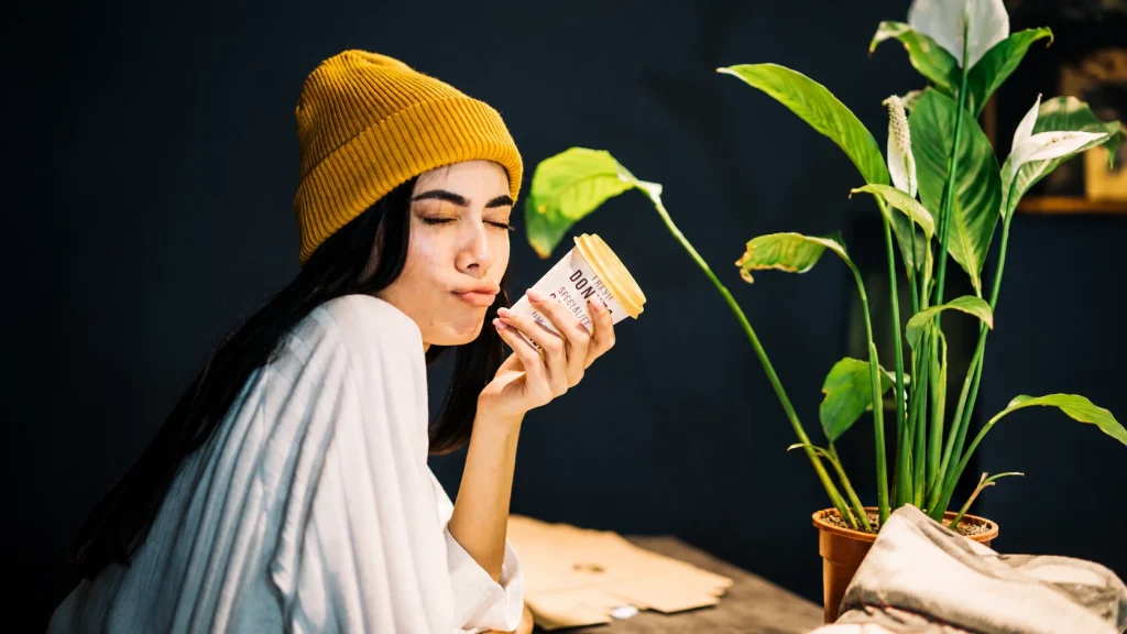 Product photographer using a large softbox to create soft lighting for a product photography setup