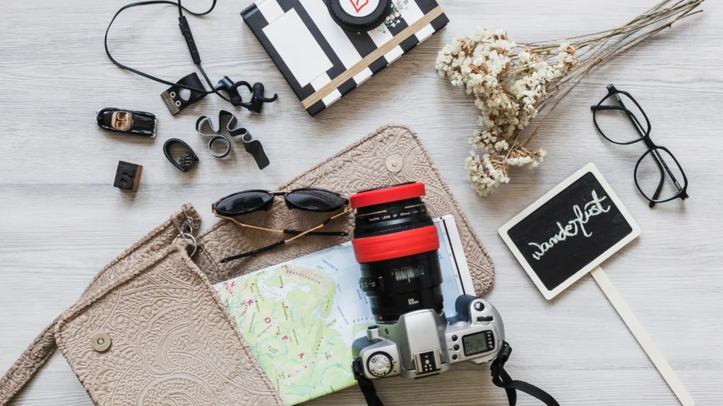 Styling accessories and props arranged with a camera for product photography