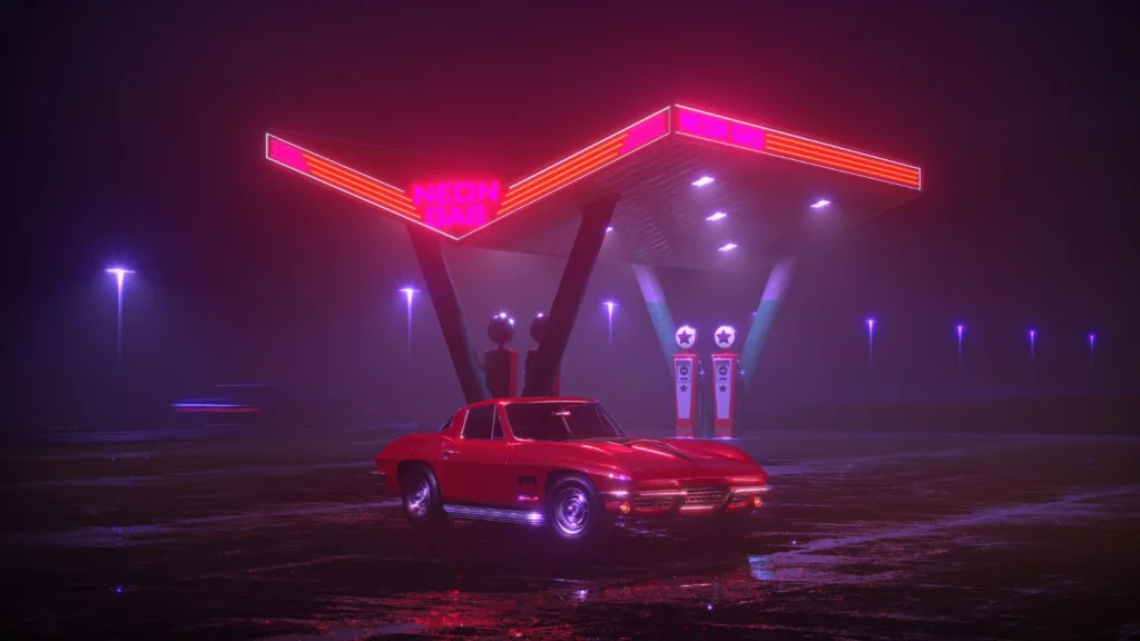 Classic red car photographed at a neon-lit gas station at night