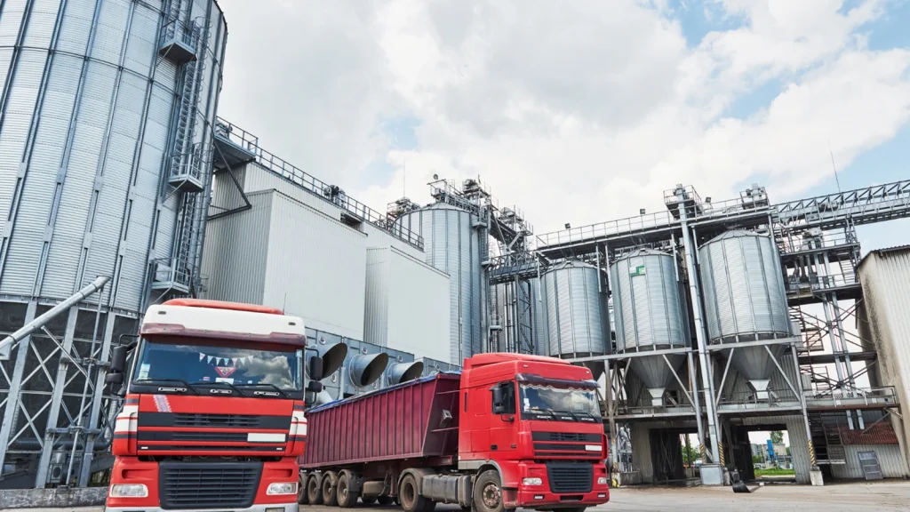 Logistics and transportation photography showing trucks at an industrial facility
