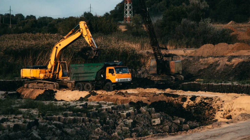Mining photography showing excavators and heavy construction equipment at a worksite