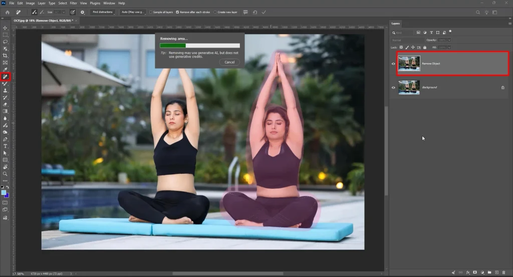 Painting over a person with the Photoshop Remove tool to remove an object from a photo