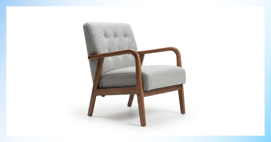 Grey tufted armchair with a walnut wood frame on a pure white background for e-commerce furniture photography